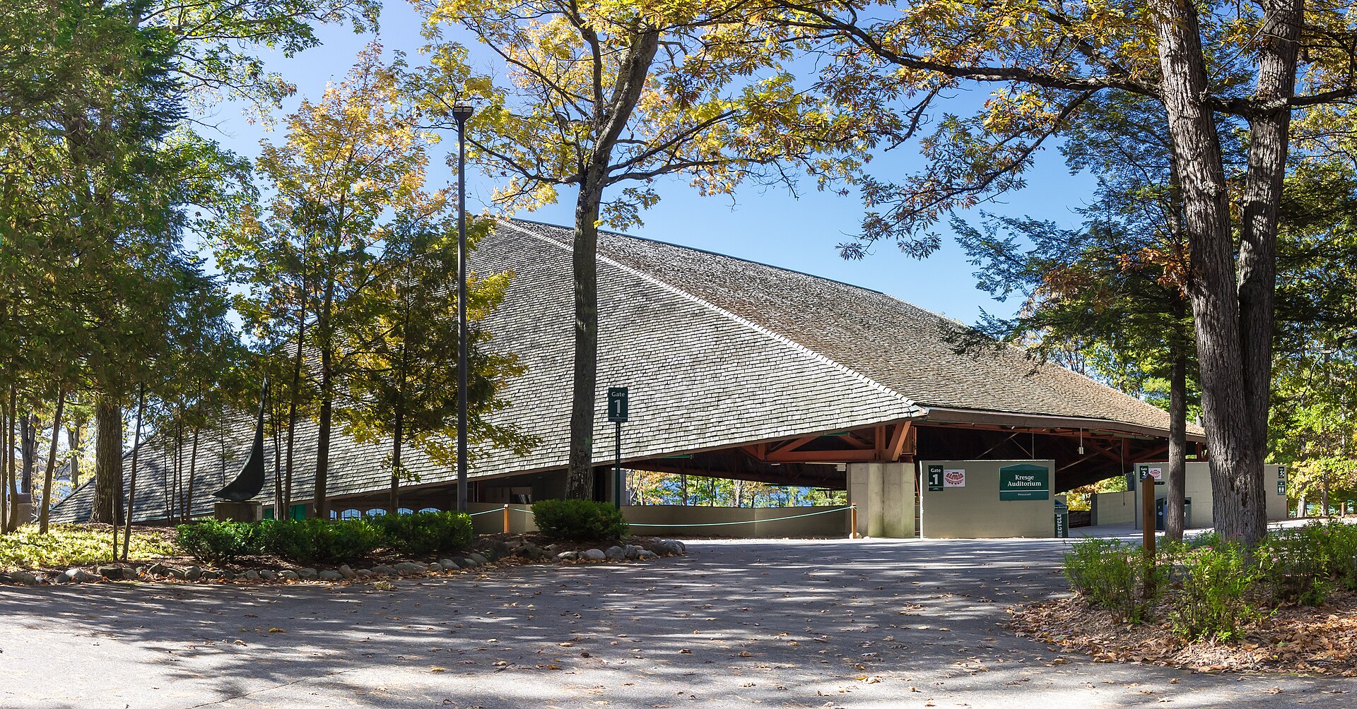 Kresge Auditorium, the open-sided lakeside concert pavilion at Interlochen Center for the Arts, surrounded by trees