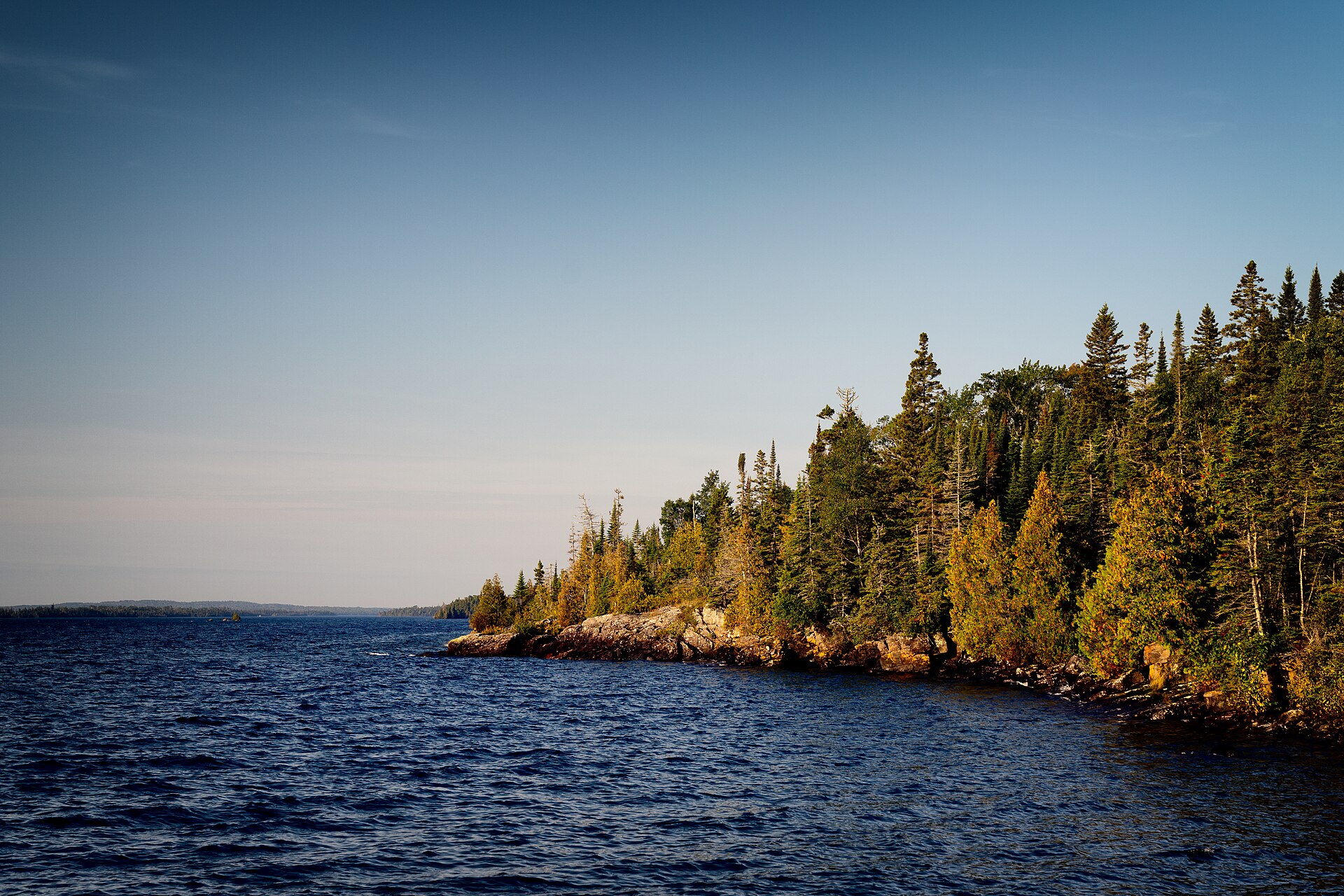 Rocky Lake Superior shoreline and spruce forest seen from the Rock Harbor docks at Isle Royale National Park