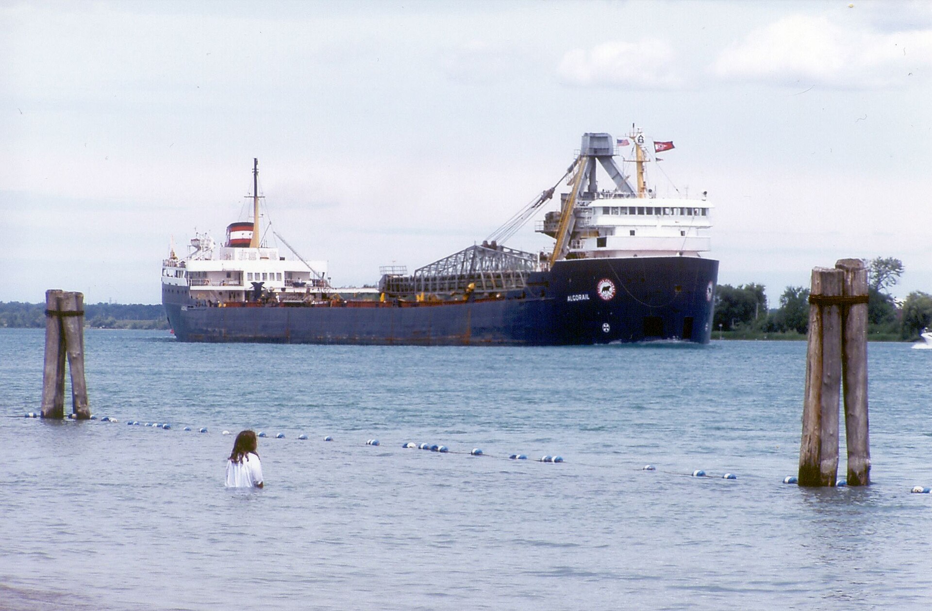 The lake freighter Algorail passing close to shore on the St. Clair River at Marine City, Michigan
