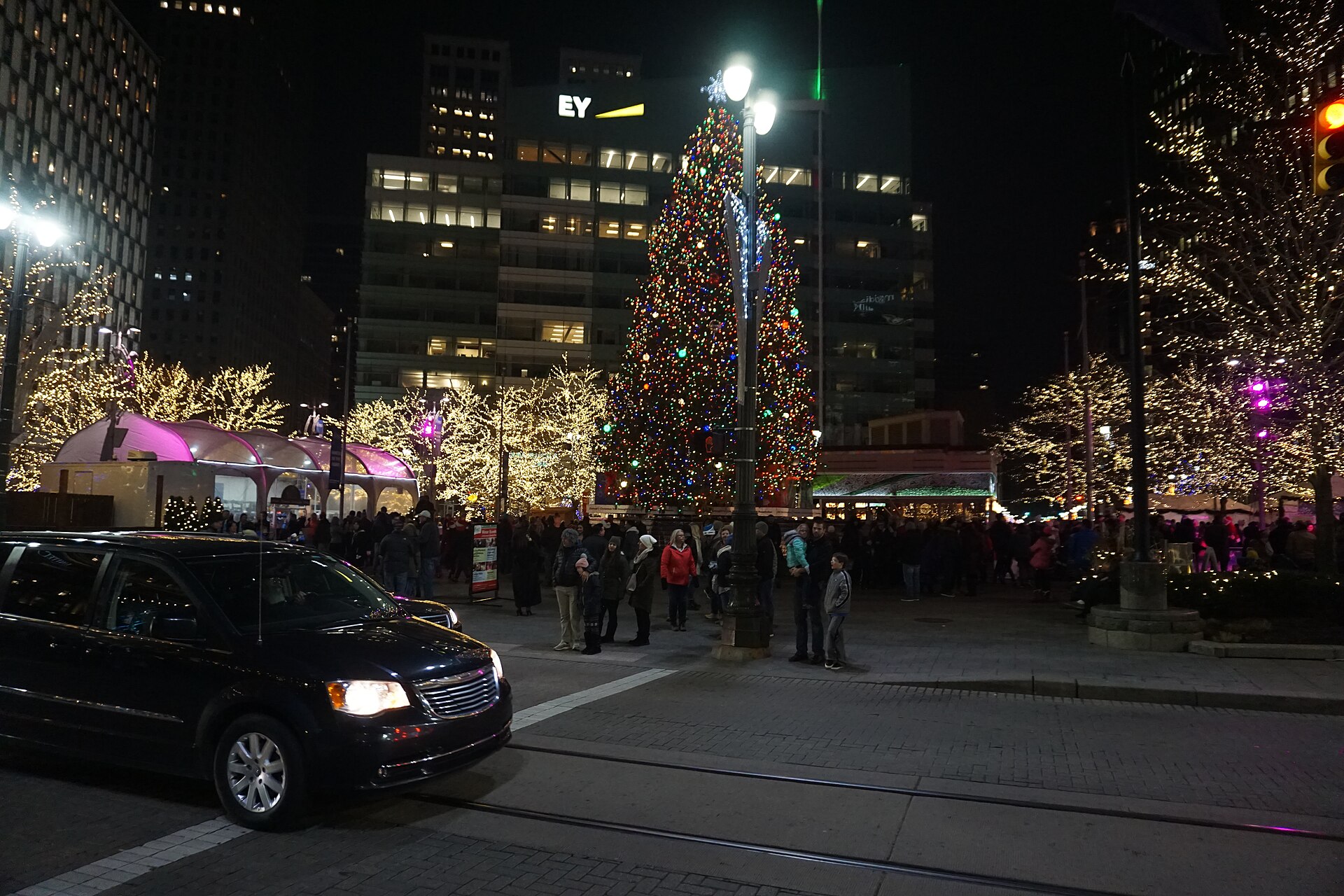 Detroit's illuminated Christmas tree and light-wrapped trees at Campus Martius Park on a December evening