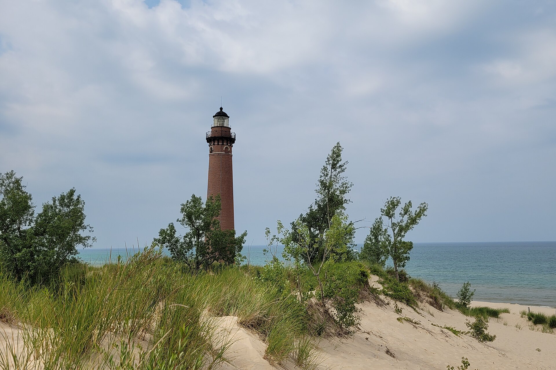 The red brick Little Sable Point Lighthouse on the Lake Michigan beach south of Silver Lake State Park